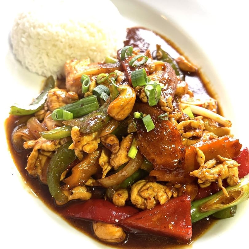 Origin Thai Bistro's cashew chicken stir-fry with bell peppers, onions, and rice.