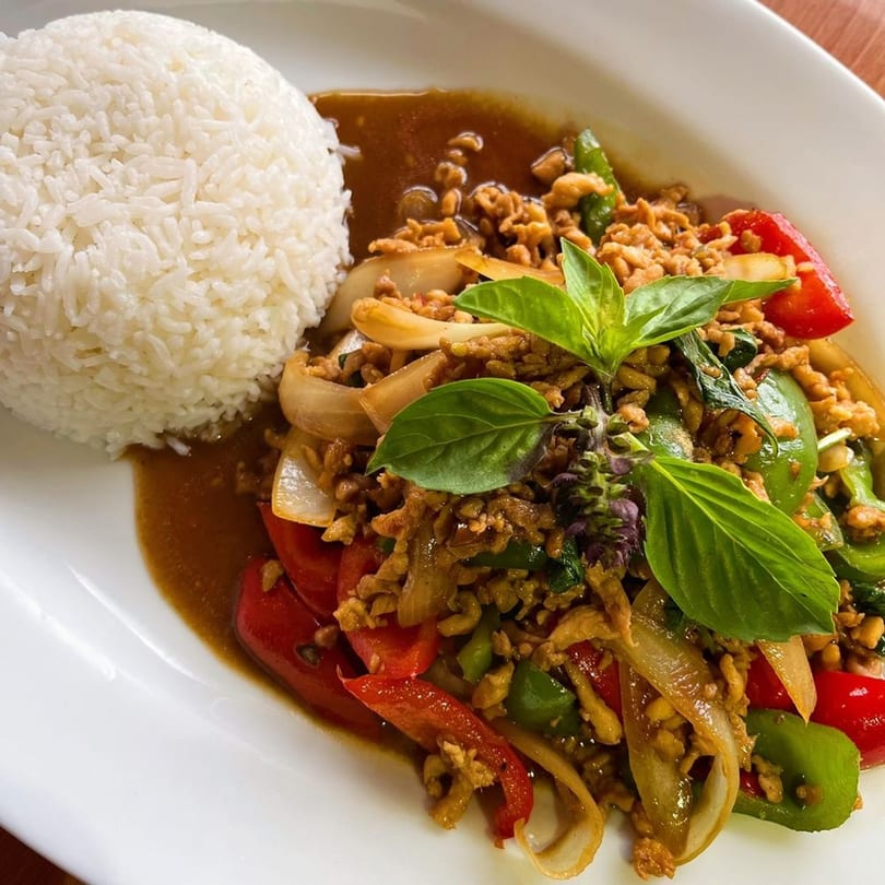 Origin Thai Bistro's Pad Krapow with minced chicken, bell peppers, onions, basil, and white rice.