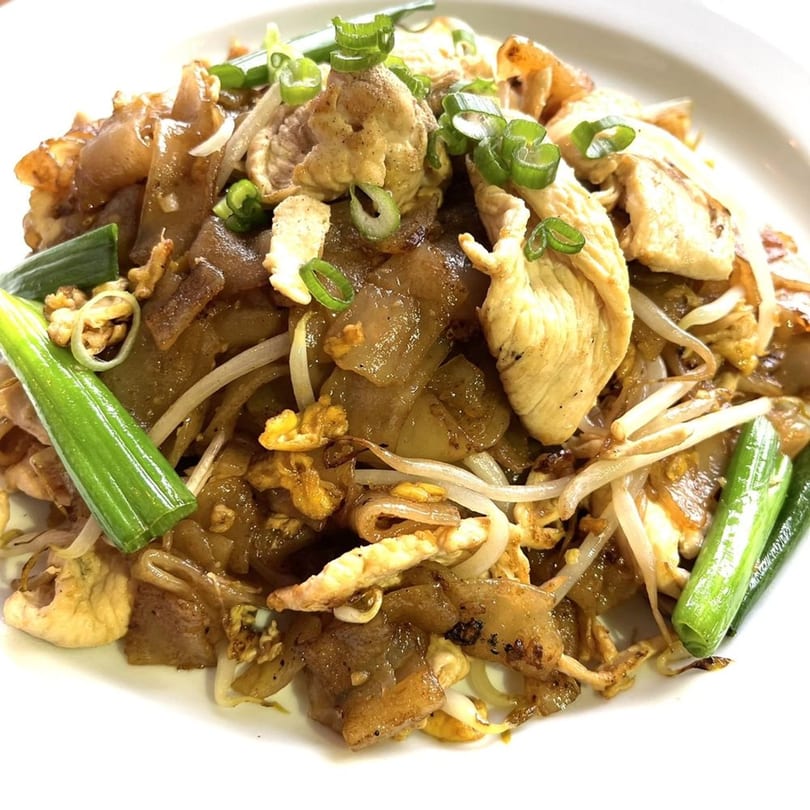 Origin Thai Bistro's Pad See Ew with chicken, wide noodles, bean sprouts, and green onions.
